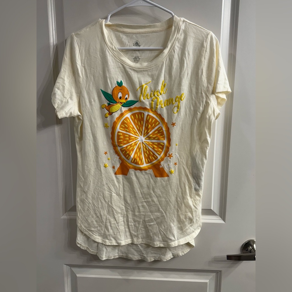Disney Cream Short Sleeve Tee with Orange Slice and Green Accent